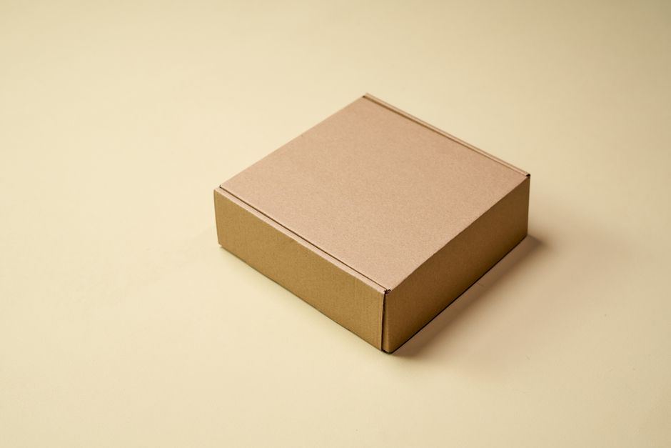 A plain kraft corrugated mailer box